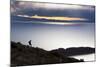 A Man Walks Along a Rocky Crest Above Lake Titicaca in Bolivia During Sunset-Sergio Ballivian-Mounted Photographic Print