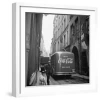 A Man Walks His Dog Beside a Bus with Coca Cola Advertisement, France, 1950-Mark Kauffman-Framed Photographic Print