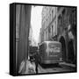 A Man Walks His Dog Beside a Bus with Coca Cola Advertisement, France, 1950-Mark Kauffman-Framed Stretched Canvas