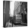 A Man Walks His Dog Beside a Bus with Coca Cola Advertisement, France, 1950-Mark Kauffman-Stretched Canvas