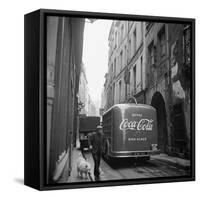 A Man Walks His Dog Beside a Bus with Coca Cola Advertisement, France, 1950-Mark Kauffman-Framed Stretched Canvas