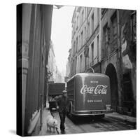 A Man Walks His Dog Beside a Bus with Coca Cola Advertisement, France, 1950-Mark Kauffman-Stretched Canvas