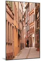 A Man Walks Through La Petite France-Julian Elliott-Mounted Photographic Print