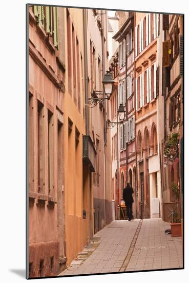 A Man Walks Through La Petite France-Julian Elliott-Mounted Photographic Print