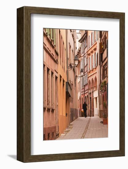 A Man Walks Through La Petite France-Julian Elliott-Framed Photographic Print