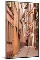 A Man Walks Through La Petite France-Julian Elliott-Mounted Photographic Print