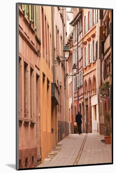 A Man Walks Through La Petite France-Julian Elliott-Mounted Photographic Print