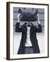 A Man Wearing a Bow Tie Hiding Behind a Bag-India Hobson-Framed Photographic Print