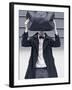 A Man Wearing a Bow Tie Hiding Behind a Bag-India Hobson-Framed Photographic Print