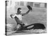 A Man with a Cowboy Hat Rides a Killer Whale-null-Stretched Canvas