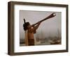 A Maori Warrior Calls Across Auckland-null-Framed Photographic Print