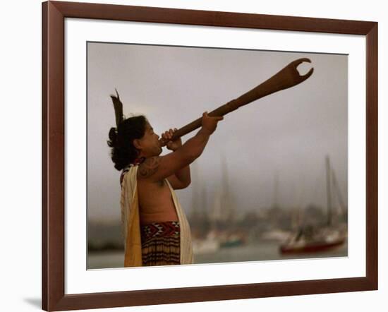 A Maori Warrior Calls Across Auckland-null-Framed Photographic Print