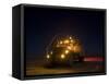 A Maxxpro MRAP Vehicle with Running Lights on at Night-null-Framed Stretched Canvas