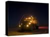 A Maxxpro MRAP Vehicle with Running Lights on at Night-null-Stretched Canvas