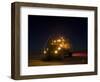 A Maxxpro MRAP Vehicle with Running Lights on at Night-null-Framed Photographic Print