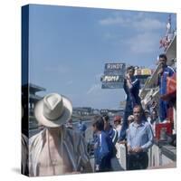 A Mechanic Holding Up a Sign, French Grand Prix, Le Mans, France, 1967-null-Stretched Canvas