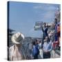 A Mechanic Holding Up a Sign, French Grand Prix, Le Mans, France, 1967-null-Stretched Canvas