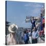 A Mechanic Holding Up a Sign, French Grand Prix, Le Mans, France, 1967-null-Stretched Canvas