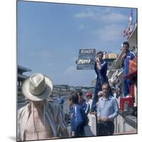 A Mechanic Holding Up a Sign, French Grand Prix, Le Mans, France, 1967-null-Mounted Photographic Print