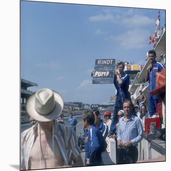 A Mechanic Holding Up a Sign, French Grand Prix, Le Mans, France, 1967-null-Mounted Photographic Print