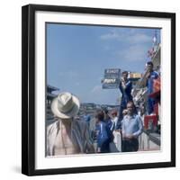 A Mechanic Holding Up a Sign, French Grand Prix, Le Mans, France, 1967-null-Framed Photographic Print