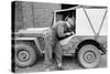 A Member of the British 49th Armoured Personnel Carrier Regiment Working Jeep's Convertible Roof-George Silk-Stretched Canvas