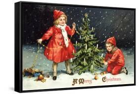 A Merry Christmas Postcard with Two Children Decorating Tree-David Pollack-Framed Stretched Canvas