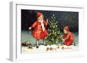 A Merry Christmas with Two Children Decorating Tree-K.J. Historical-Framed Giclee Print