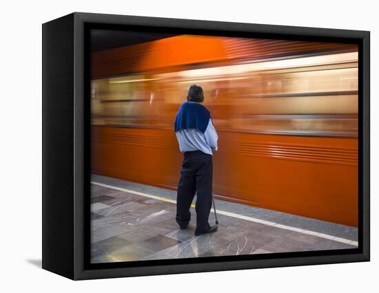 A Mexican Citizen Waits for the Metro to Stop, Mexico City, Mexico-Brent Bergherm-Framed Stretched Canvas