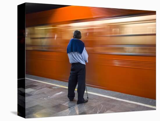 A Mexican Citizen Waits for the Metro to Stop, Mexico City, Mexico-Brent Bergherm-Stretched Canvas