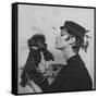 A Model Wearing a Hat Trimmed with Feathers-null-Framed Stretched Canvas