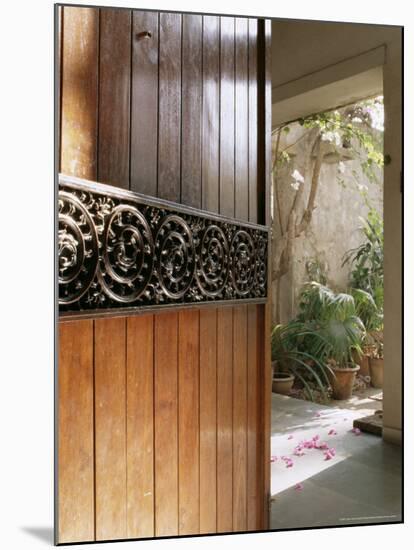 A Modern Front Door Decorated with a 400 Year Old Piece of Wood Carving-John Henry Claude Wilson-Mounted Photographic Print