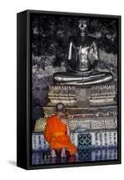 A Monk Prays in Front of a Golden Buddha, Wat Suthat, Bangkok, Thailand, Southeast Asia, Asia-Andrew Taylor-Framed Stretched Canvas