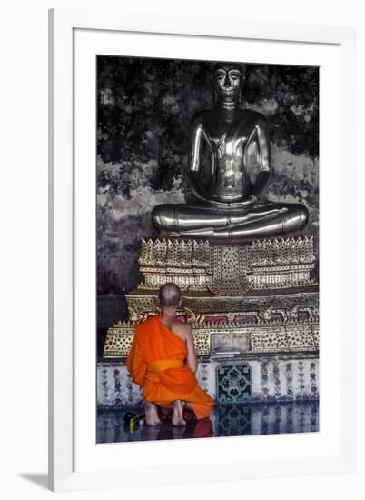 A Monk Prays in Front of a Golden Buddha, Wat Suthat, Bangkok, Thailand, Southeast Asia, Asia-Andrew Taylor-Framed Photographic Print