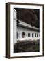 A Monk Sits and Looks at His Phone Beneath Shelter-Charlie-Framed Photographic Print