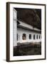 A Monk Sits and Looks at His Phone Beneath Shelter-Charlie-Framed Photographic Print