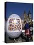 A Moravian Woman Decorating a Large Egg with Easter Designs on the Old Town Square, Prague-Richard Nebesky-Stretched Canvas