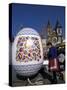 A Moravian Woman Decorating a Large Egg with Easter Designs on the Old Town Square, Prague-Richard Nebesky-Stretched Canvas