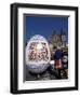 A Moravian Woman Decorating a Large Egg with Easter Designs on the Old Town Square, Prague-Richard Nebesky-Framed Photographic Print