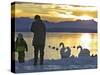 A Mother and Child Feed Water Fowl on the Ice Covered Shores of Lake Chiemsee-null-Stretched Canvas