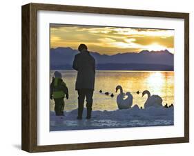 A Mother and Child Feed Water Fowl on the Ice Covered Shores of Lake Chiemsee-null-Framed Photographic Print