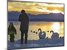 A Mother and Child Feed Water Fowl on the Ice Covered Shores of Lake Chiemsee-null-Mounted Photographic Print