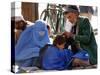 A Mother Watches as Her Child Gets a Haircut in the Center of Kabul, Afghanistan on Oct. 9, 2003.-null-Stretched Canvas