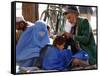 A Mother Watches as Her Child Gets a Haircut in the Center of Kabul, Afghanistan on Oct. 9, 2003.-null-Framed Stretched Canvas