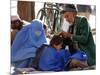 A Mother Watches as Her Child Gets a Haircut in the Center of Kabul, Afghanistan on Oct. 9, 2003.-null-Mounted Photographic Print