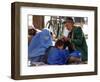 A Mother Watches as Her Child Gets a Haircut in the Center of Kabul, Afghanistan on Oct. 9, 2003.-null-Framed Photographic Print