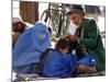 A Mother Watches as Her Child Gets a Haircut in the Center of Kabul, Afghanistan on Oct. 9, 2003.-null-Mounted Photographic Print