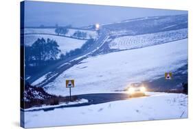 A Motorist Drives Through a Wintry Landscape on the B4520-Graham Lawrence-Stretched Canvas