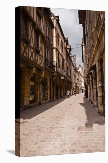 A Narrow Street with Half Timbered Houses in the Old City of Dijon, Burgundy, France, Europe-Julian Elliott-Stretched Canvas