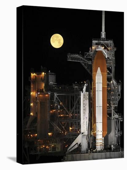 A Nearly Full Moon Sets As Space Shuttle Discovery Sits Atop the Launch Pad-Stocktrek Images-Stretched Canvas